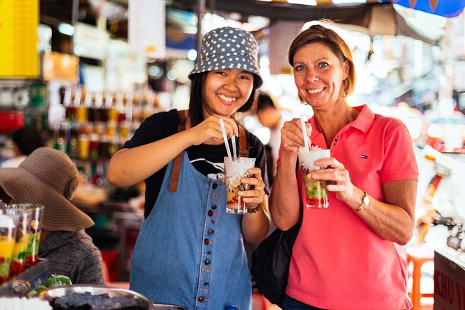 The 10 Tastings of Ho Chi Minh City With Locals: Private Street Food Tour - Independence Palace and sugar cane juice on a hot day