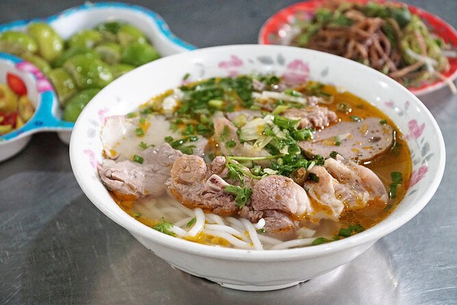 The Unique Ao Dai Street Food Tour By Scooter - Stop 4: Ho Thi Ky Flower Market and eating while you wander