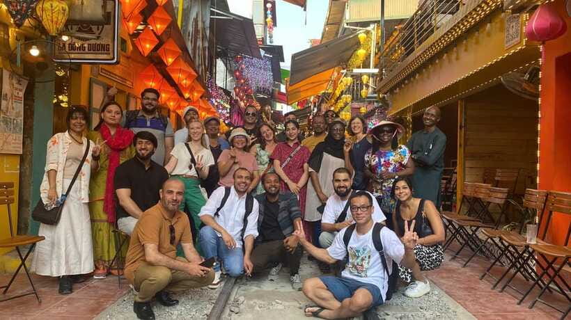 Uncover Hanoi’s Hidden Treasures: Old Quarter & Train Street - Dong Xuan Market Stop and Long Biên Bridge Photos: Past Meets Today
