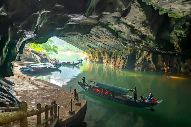 Zipline Dark cave & Paradise cave: Full-day Exploration - Dark Cave (Hang Tối): zipline over turquoise water, plus the mud bath